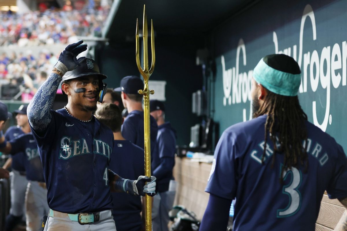 Sep 20, 2024; Arlington, Texas, USA; Seattle Mariners center fielder Julio Rodriguez (44) is congratulated by shortstop J.P. Crawford (3) after his three-run home run against the Texas Rangers in the fifth inning at Globe Life Field. Mandatory Credit: Tim Heitman-Imagn Images