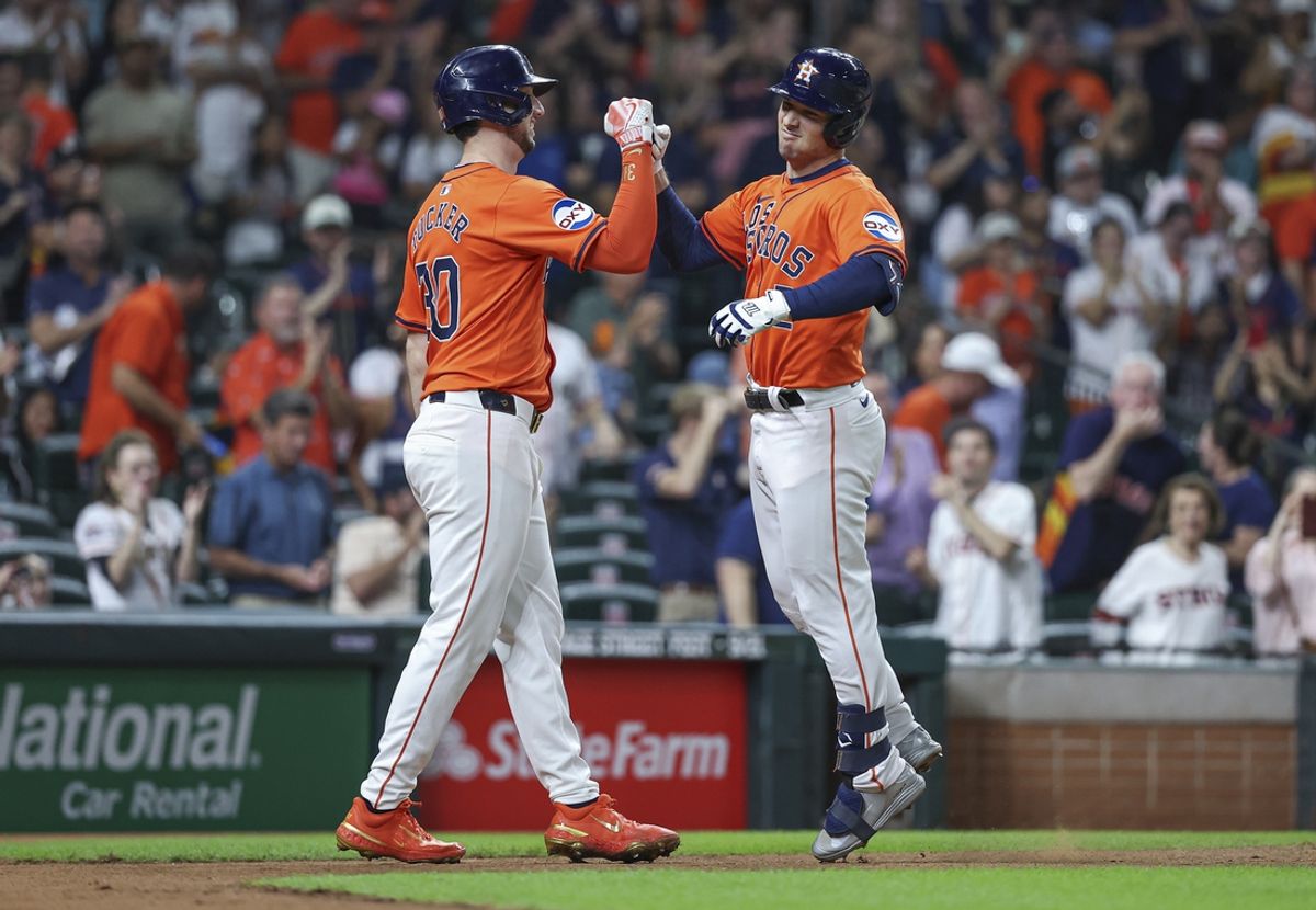 Sep 20, 2024; Houston, Texas, USA; Houston Astros third baseman Alex Bregman (2) celebrates with right fielder Kyle Tucker (30) after hitting a home run during the third inning at Minute Maid Park. Mandatory Credit: Troy Taormina-Imagn Images