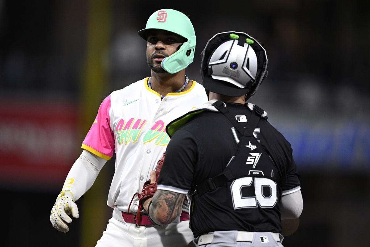 Sep 20, 2024; San Diego, California, USA; San Diego Padres shortstop Xander Bogaerts (2) is tagged out by Chicago White Sox catcher Korey Lee (26) after being caught in a rundown during the fifth inning at Petco Park. Mandatory Credit: Orlando Ramirez-Imagn Images