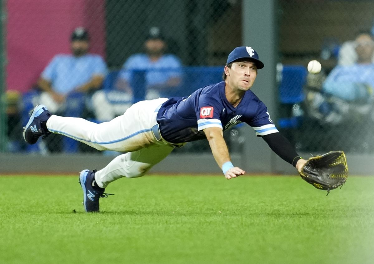 Sep 20, 2024; Kansas City, Missouri, USA; Kansas City Royals right fielder Adam Frazier (26) makes a diving catch during the sixth inning against the San Francisco Giants at Kauffman Stadium. Mandatory Credit: Jay Biggerstaff-Imagn Images
