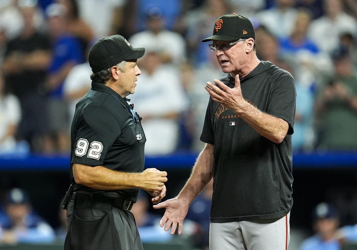 Sep 20, 2024; Kansas City, Missouri, USA; San Francisco Giants manager Bob Melvin (6) talks with umpire James Hoye (92) during the ninth inning against the Kansas City Royals at Kauffman Stadium. Mandatory Credit: Jay Biggerstaff-Imagn Images