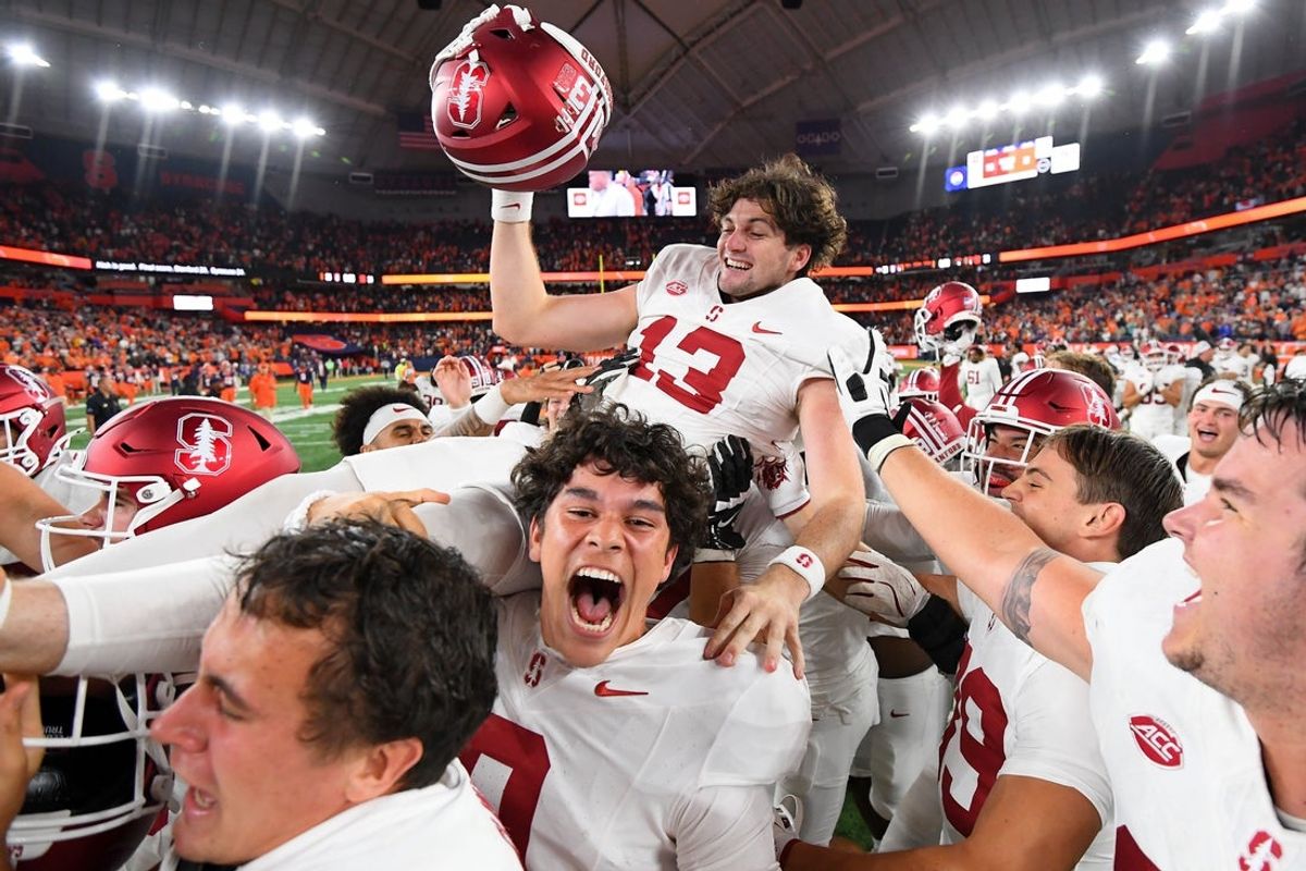 Sep 20, 2024; Syracuse, New York, USA; Stanford Cardinal place kicker Emmet Kenney (13) is carried by teammates following his game winning field goal against the Syracuse Orange at the JMA Wireless Dome. Mandatory Credit: Rich Barnes-Imagn Images