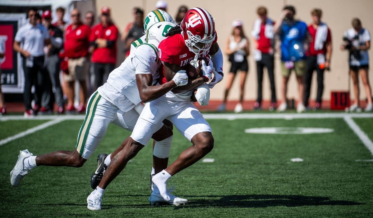 Indiana's Andison Coby (0) carries defenders during the Indiana versus Charlotte football game at Memorial Stadium on Saturday, Sept. 21, 2024.