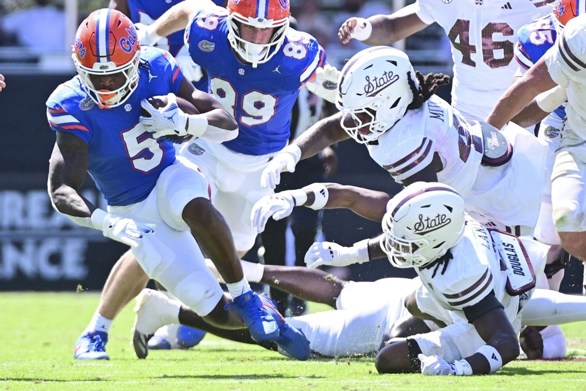 Sep 21, 2024; Starkville, Mississippi, USA; Florida Gators running back Treyaun Webb (5) runs the ball against the Mississippi State Bulldogs during the second quarter at Davis Wade Stadium at Scott Field. Mandatory Credit: Matt Bush-Imagn Images