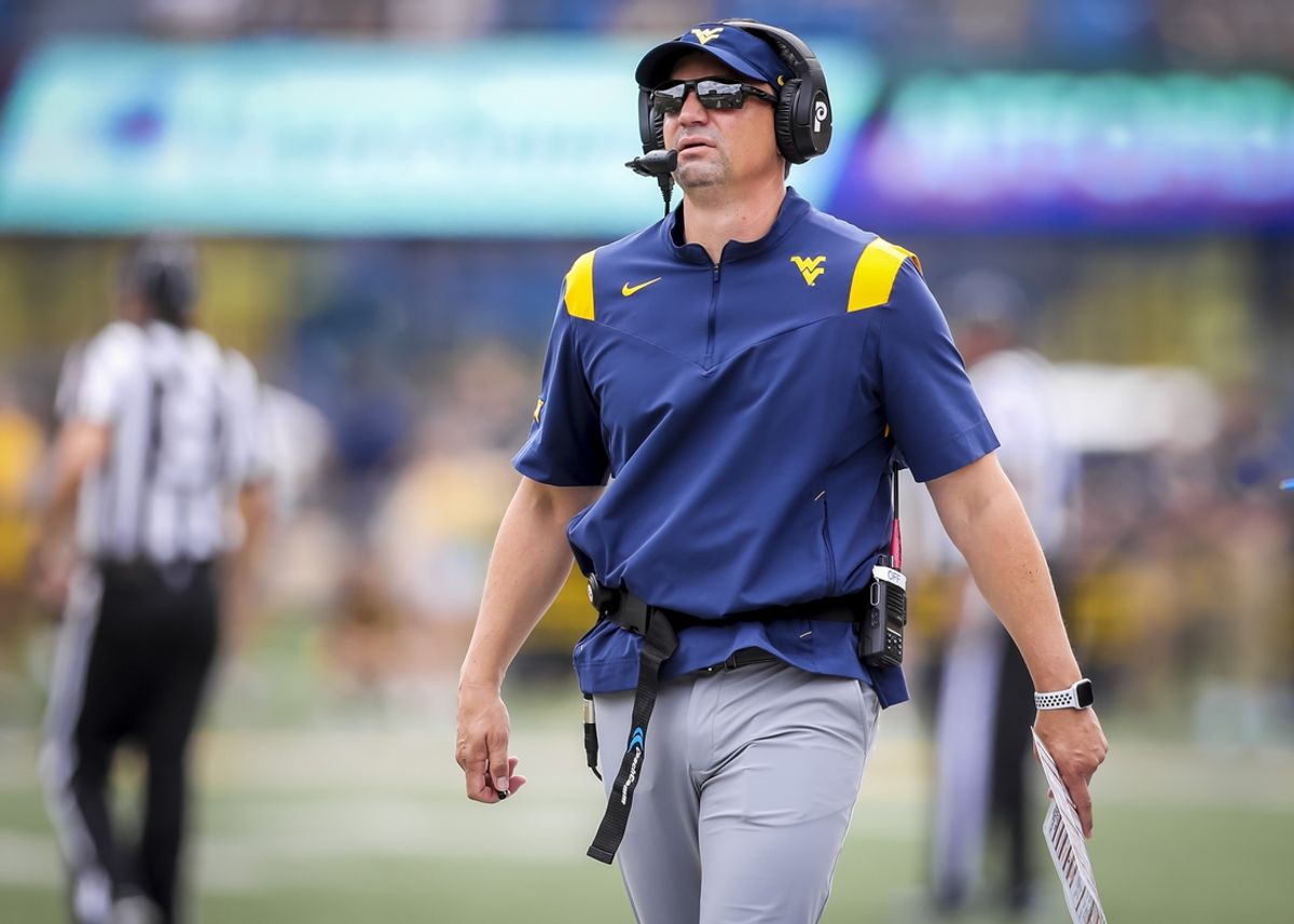 Sep 21, 2024; Morgantown, West Virginia, USA; West Virginia Mountaineers head coach Neal Brown walks along the sidelines during the second quarter against the Kansas Jayhawks at Mountaineer Field at Milan Puskar Stadium. Mandatory Credit: Ben Queen-Imagn Images