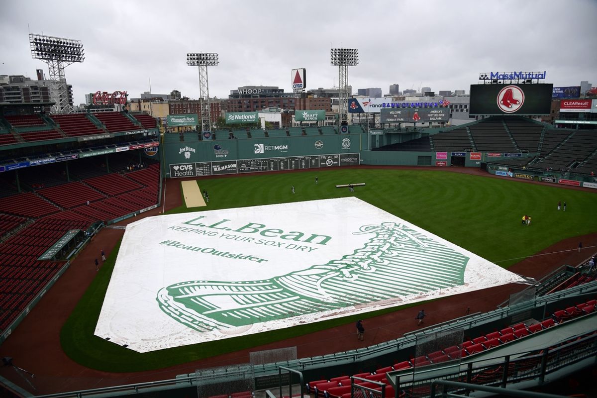 Sep 21, 2024; Boston, Massachusetts, USA;  A view of the tarp on the field prior to a game between the Boston Red Sox and Minnesota Twins at Fenway Park. Mandatory Credit: Bob DeChiara-Imagn Images