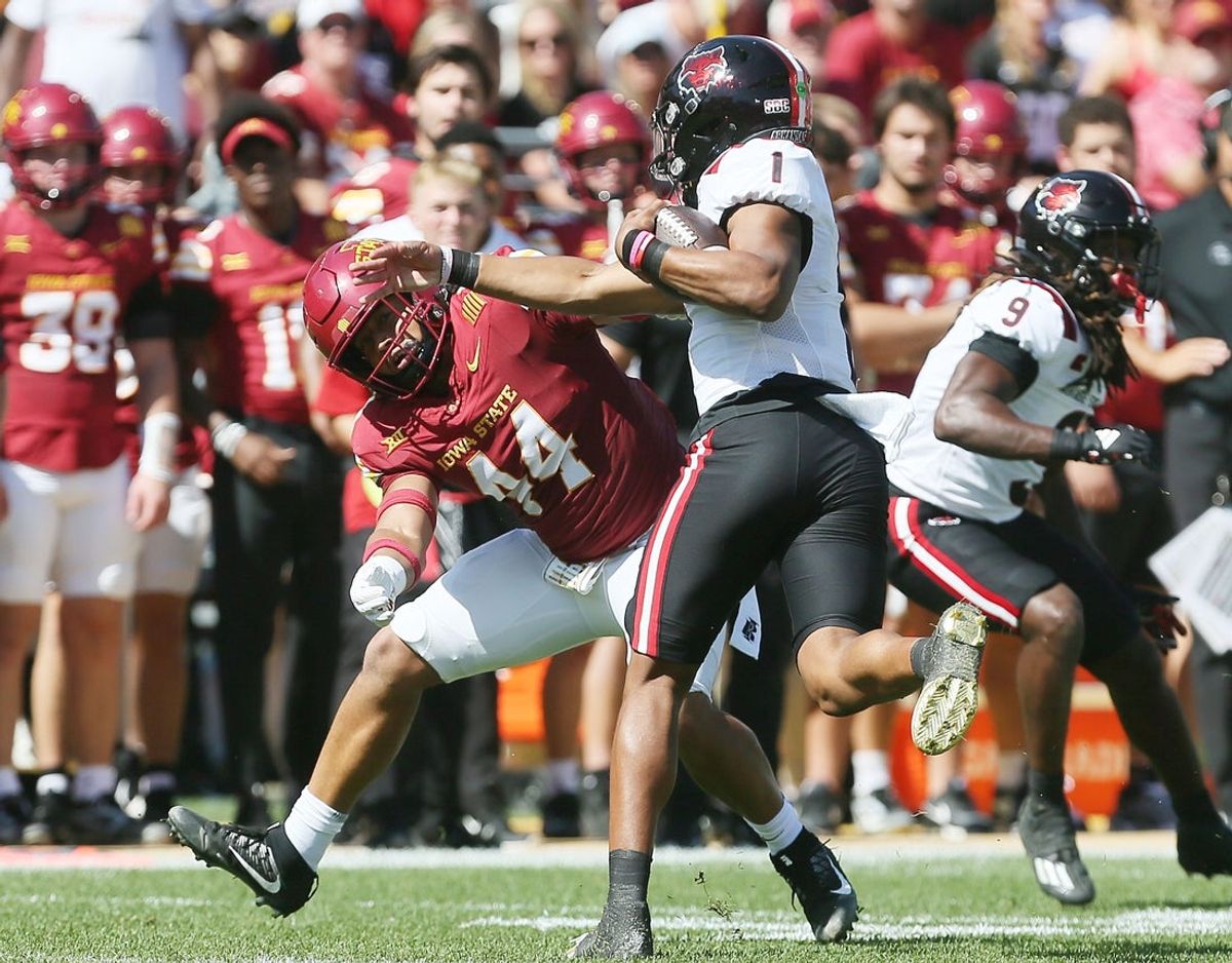Iowa State Cyclones linebacker Jacob Ellis (44) tries to take down Arkansas State Red Wolves quarterback Jaylen Raynor (1) during the first quarter in the week-4 NCAA football at Jack Trice Stadium on Saturday, Sept. 21, 2024, in Ames, Iowa.