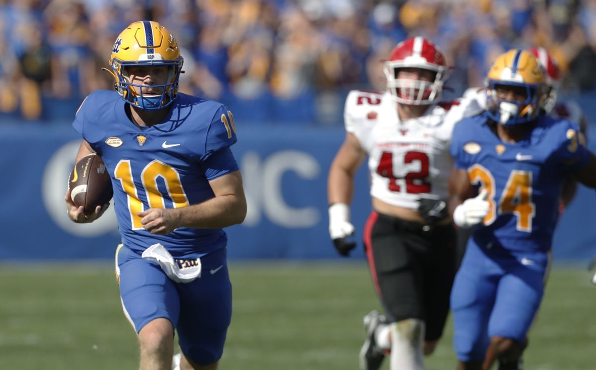 Sep 21, 2024; Pittsburgh, Pennsylvania, USA; Pittsburgh Panthers quarterback Eli Holstein (10) carries the ball against the Youngstown State Penguins during the first quarter at Acrisure Stadium. Mandatory Credit: Charles LeClaire-Imagn Images