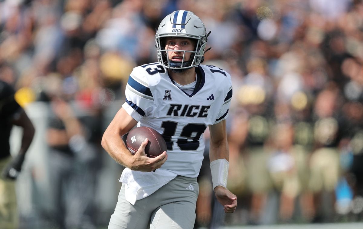 Sep 21, 2024; West Point, New York, USA; Rice Owls quarterback E.J. Warner (13) runs with the ball against the Army Black Knights during the first half at Michie Stadium. Mandatory Credit: Danny Wild-Imagn Images