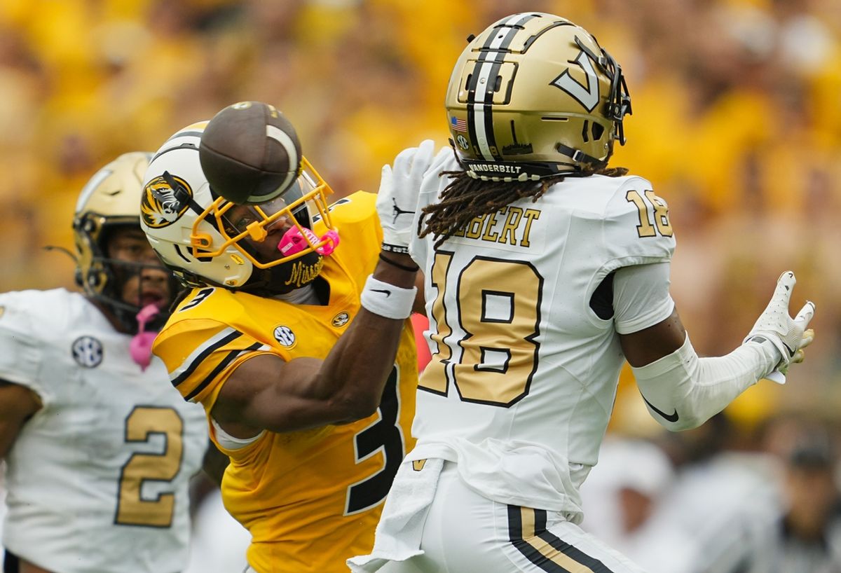 Sep 21, 2024; Columbia, Missouri, USA; Missouri Tigers wide receiver Luther Burden III (3) is unable to make a catch against Vanderbilt Commodores safety Jalen Gilbert (18) during the first half at Faurot Field at Memorial Stadium. Mandatory Credit: Jay Biggerstaff-Imagn Images