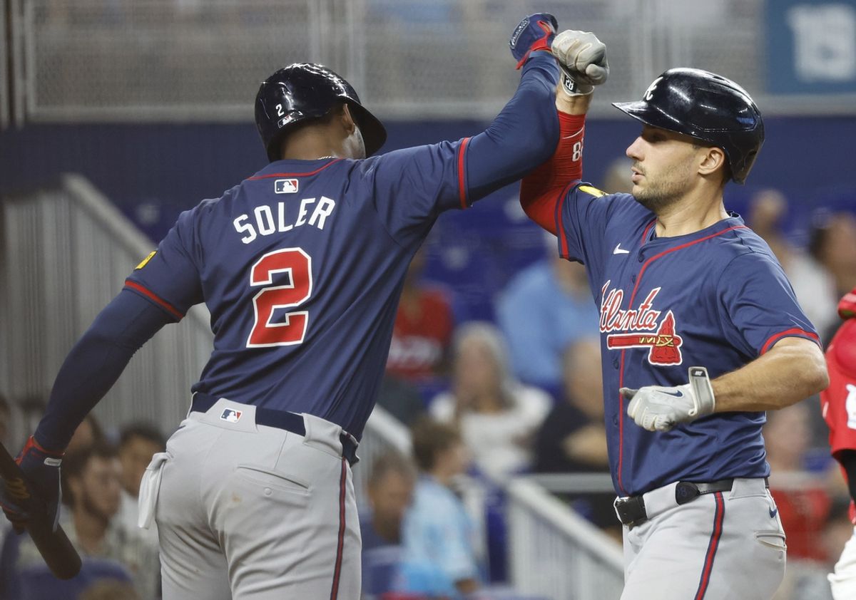 Sep 21, 2024; Miami, Florida, USA;  Atlanta Braves first baseman Matt Olson (28) celebrates with right fielder Jorge Soler (2) after hitting a home run against the Miami Marlins in the seventh inning at loanDepot Park. Mandatory Credit: Rhona Wise-Imagn Images