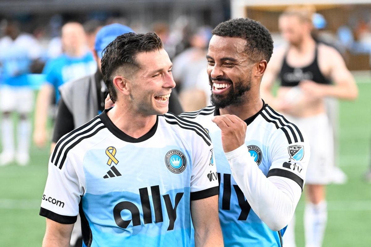 Sep 21, 2024; Charlotte, North Carolina, USA; Charlotte FC midfielder Brandt Bronico (front) and defender Nathan Byrne celebrate after the game at Bank of America Stadium. Mandatory Credit: Bob Donnan-Imagn Images