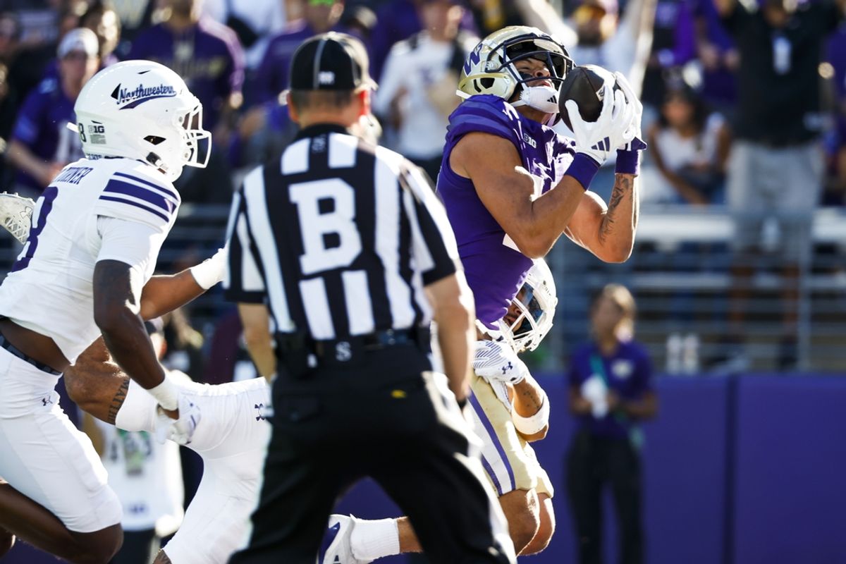 Sep 21, 2024; Seattle, Washington, USA; Washington Huskies wide receiver Denzel Boston (12) catches a touchdown pass against the Northwestern Wildcats during the first quarter at Alaska Airlines Field at Husky Stadium. Mandatory Credit: Joe Nicholson-Imagn Images
