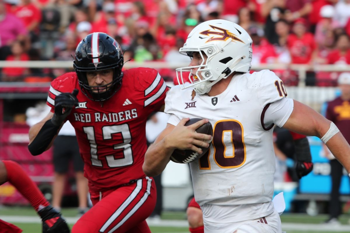 Sep 21, 2024; Lubbock, Texas, USA;  Texas Tech Red Raiders defensive back Ben Roberts (13) pressures Arizona State Sun Devils quarterback Sam Leavitt (10) in the second half at Jones AT&T Stadium and Cody Campbell Field. Mandatory Credit: Michael C. Johnson-Imagn Images