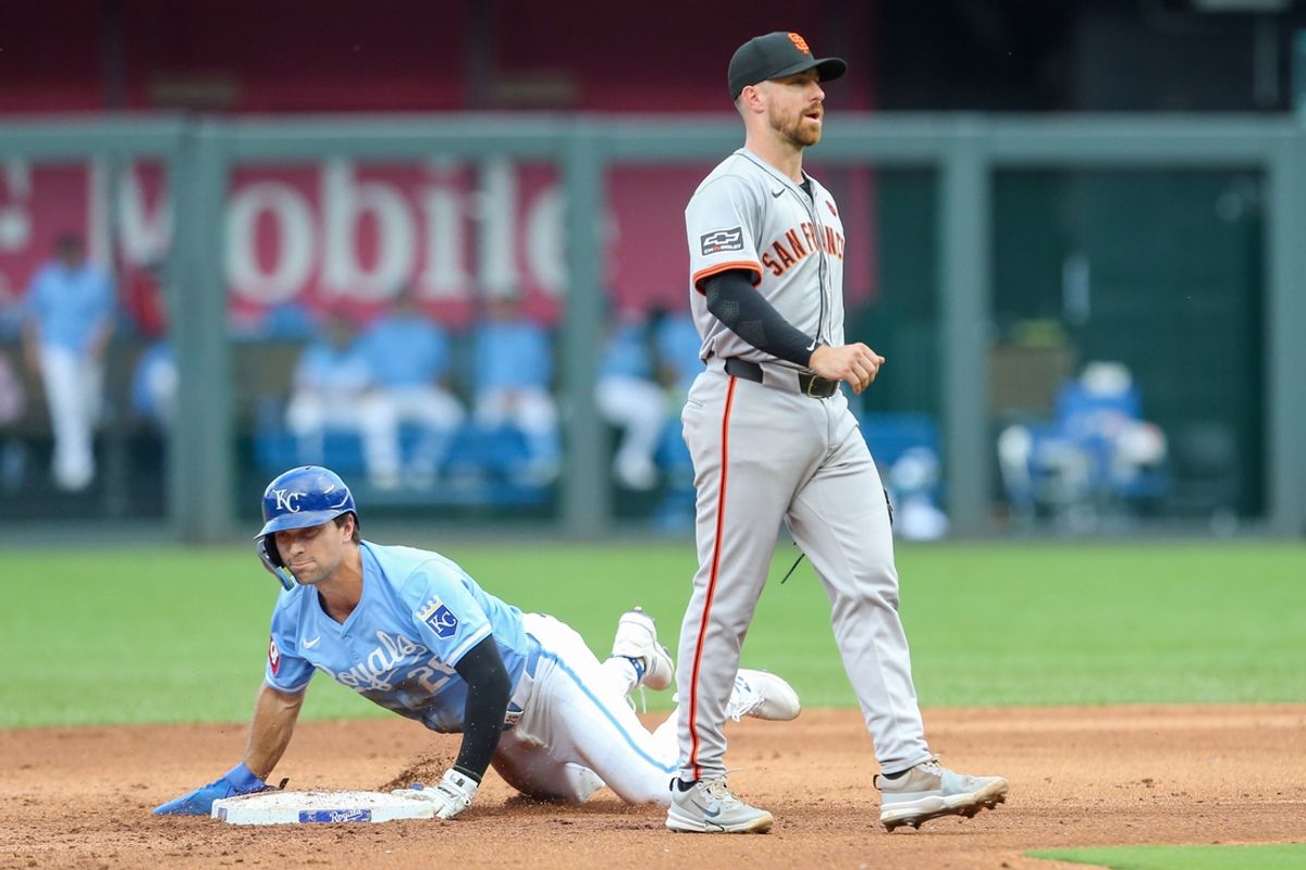 Sep 21, 2024; Kansas City, Missouri, USA; Kansas City Royals second baseman Adam Frazier (26) slides easily into second base during the bottom of the fifth inning against the San Francisco Giants at Kauffman Stadium. Mandatory Credit: Scott Sewell-Imagn Images