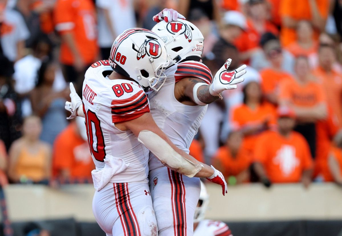 Utah's Brant Kuithe (80) celebrates a touchdown with Micah Bernard (2) in the second half of the college football between the Oklahoma State University Cowboys and the Utah Utes at Boone Pickens Stadium in Stillwater, Okla., Saturday, Sept., 21, 2024.