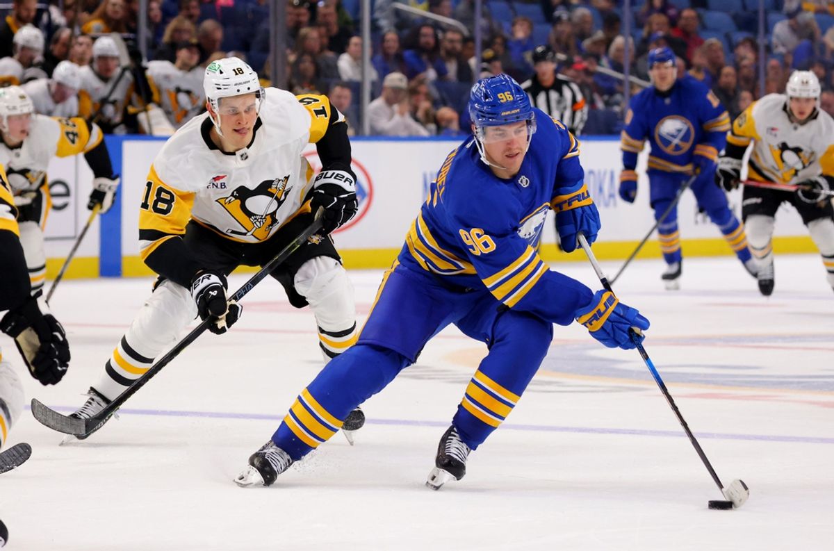 Sep 21, 2024; Buffalo, New York, USA;  Buffalo Sabres right wing Nicolas Aube-Kubel (96) controls the puck as Pittsburgh Penguins right wing Jesse Puljujarvi (18) defends during the second period at KeyBank Center. Mandatory Credit: Timothy T. Ludwig-Imagn Images