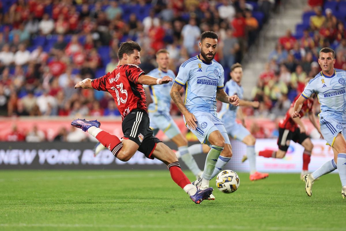 Sep 21, 2024; Harrison, New Jersey, USA; New York Red Bulls forward Dante Vanzeir (13) shoots the ball against Atlanta United during the second half at Red Bull Arena. Mandatory Credit: Thomas Salus-Imagn Images