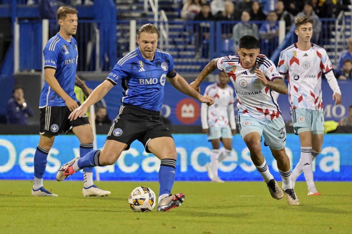 Sep 21, 2024; Montreal, Quebec, CAN; CF Montreal midfielder Samuel Piette (6) kicks the ball against Chicago Fire FC midfielder Federico Navarro (31) during the second half at Stade Saputo. Mandatory Credit: Eric Bolte-Imagn Images