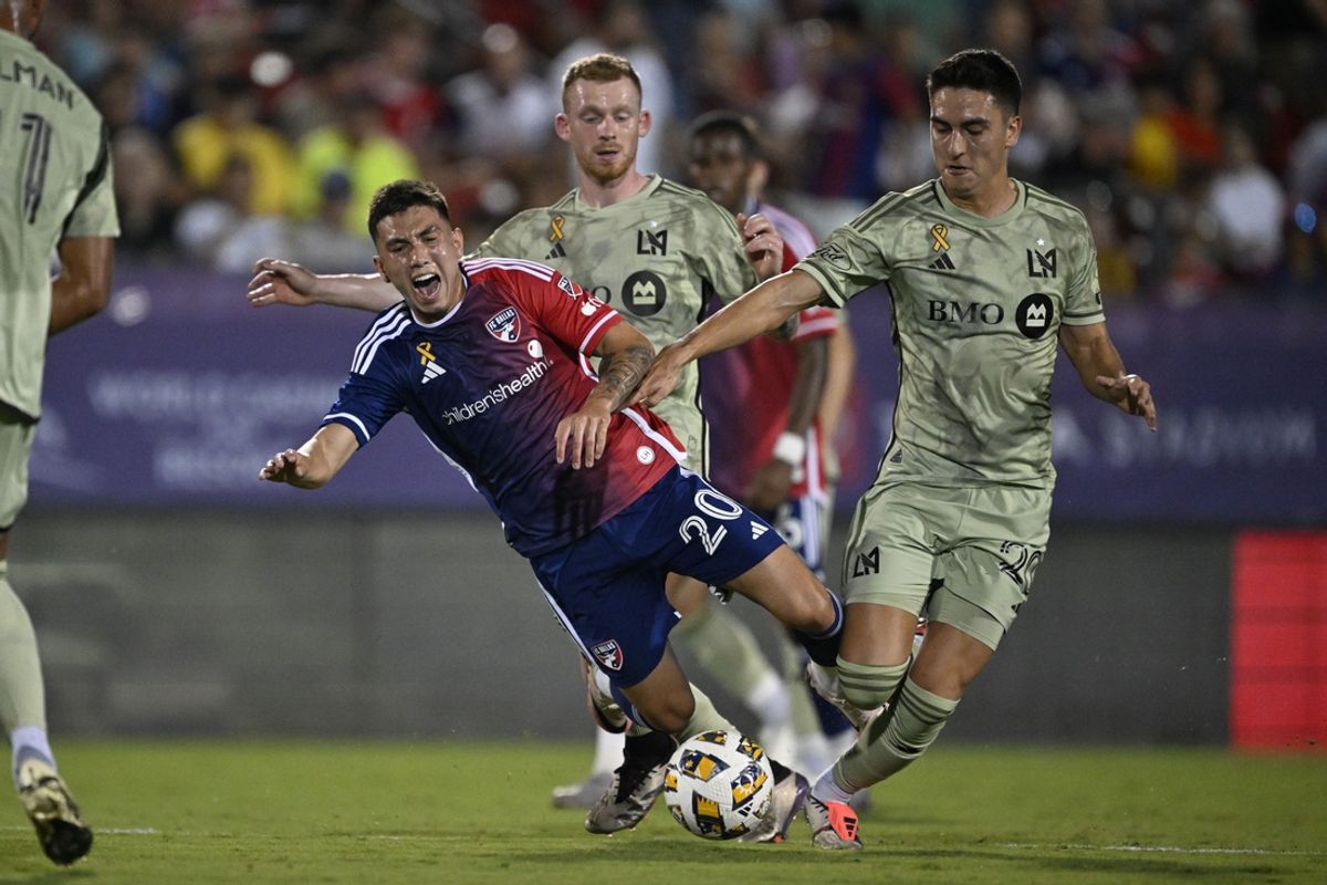 Sep 21, 2024; Frisco, Texas, USA; LAFC midfielder Eduard Atuesta (20) tackles the ball away from FC Dallas forward Alan Velasco (20) in the first half at Toyota Stadium. Mandatory Credit: Jerome Miron-Imagn Images