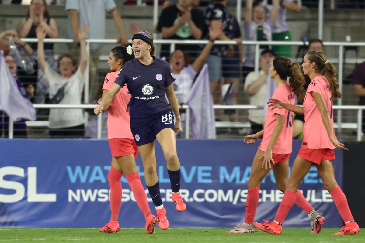 Sep 21, 2024; Louisville, Kentucky, USA; Racing Louisville FC forward Bethany Balcer (88) celebrates after scoring a goal against the North Carolina Courage in the second half at Lynn Family Stadium. Mandatory Credit: EM Dash-Imagn Images
