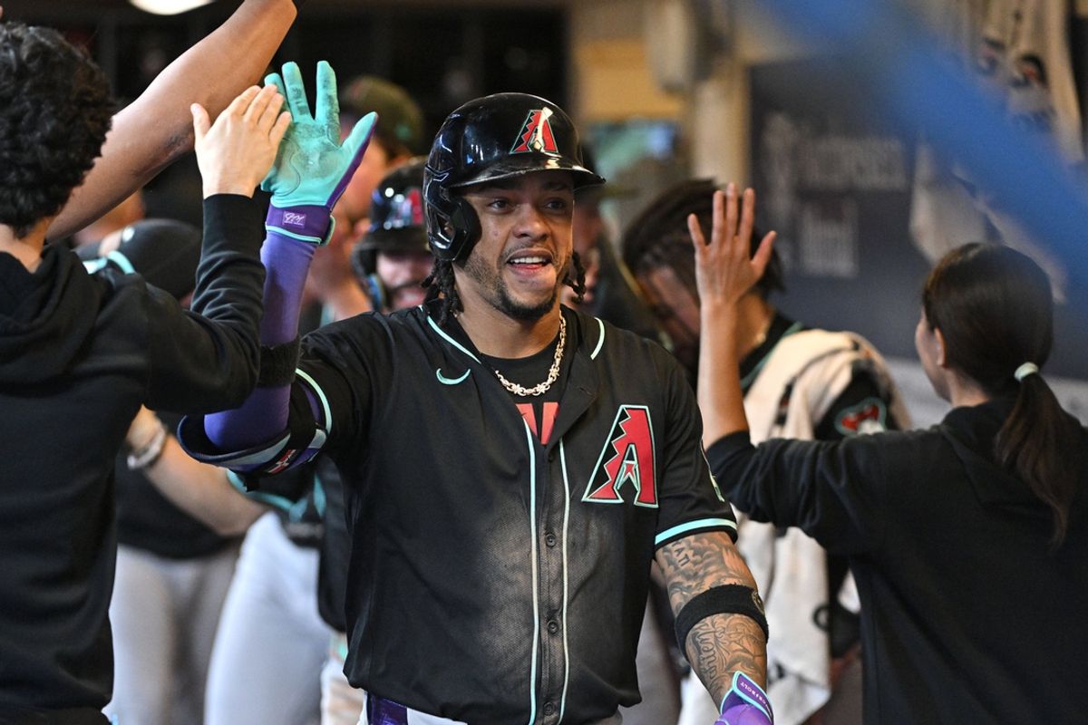 Sep 21, 2024; Milwaukee, Wisconsin, USA; Arizona Diamondbacks second base Ketel Marte (4) celebrates in the dug out after hitting a home run against the Milwaukee Brewers in the ninth inning at American Family Field. Mandatory Credit: Michael McLoone-Imagn Images