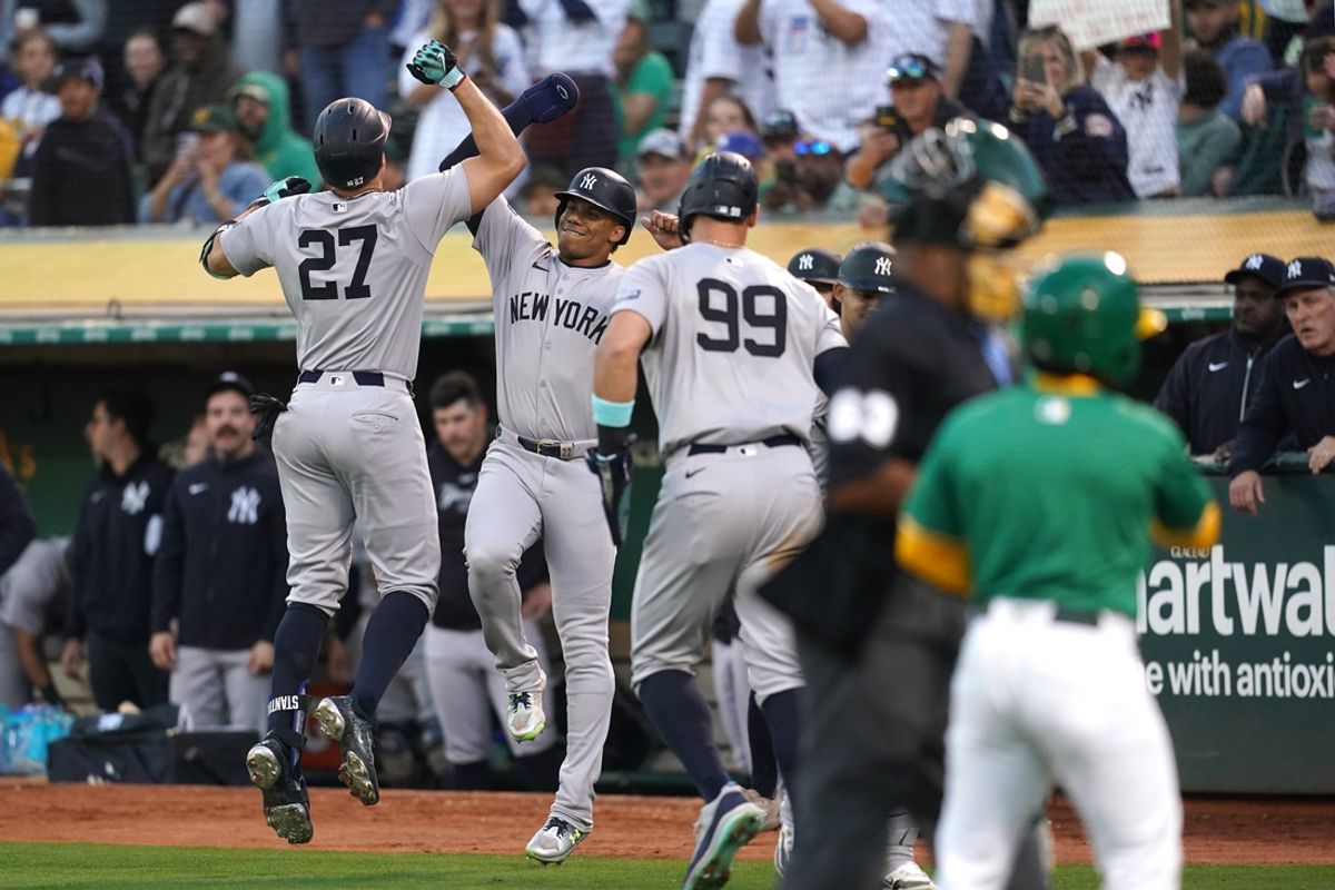 Sep 21, 2024; Oakland, California, USA; New York Yankees designated hitter Giancarlo Stanton (27) is congratulated by right fielder Juan Soto (22) after hitting a three-run home run against the Oakland Athletics in the third inning at the Oakland-Alameda County Coliseum. Mandatory Credit: Cary Edmondson-Imagn Images