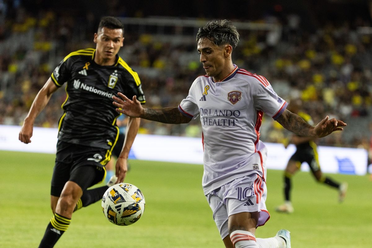 Sep 21, 2024; Columbus, Ohio, USA; Orlando City midfielder Facundo Torres (10) dribbles the ball while Columbus Crew defender Andres Herrera (2) defends in the second half at Lower.com Field. Mandatory Credit: Trevor Ruszkowski-Imagn Images