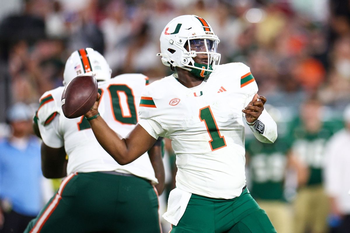 Sep 21, 2024; Tampa, Florida, USA; Miami Hurricanes quarterback Cam Ward (1) throws a pass against the South Florida Bulls in the third quarter at Raymond James Stadium. Mandatory Credit: Nathan Ray Seebeck-Imagn Images