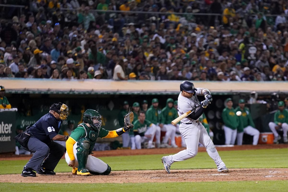Sep 21, 2024; Oakland, California, USA; New York Yankees second baseman Gleyber Torres (25) hits a two-run single against the Oakland Athletics in the seventh inning at the Oakland-Alameda County Coliseum. Mandatory Credit: Cary Edmondson-Imagn Images