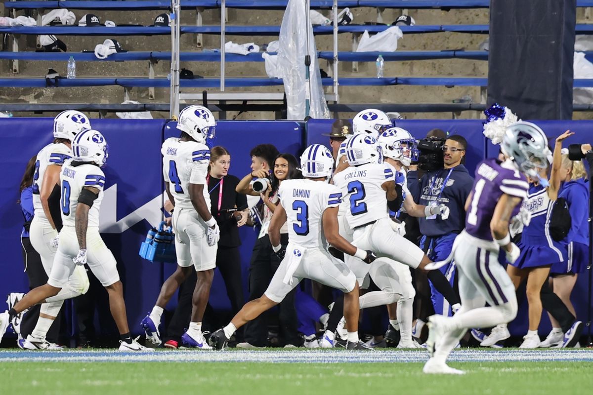 Sep 21, 2024; Provo, Utah, USA; The Brigham Young Cougars celebrate a touchdown on a fumble by the against the Kansas State Wildcats during the second quarter at LaVell Edwards Stadium. Mandatory Credit: Rob Gray-Imagn Images