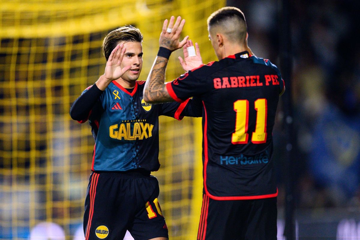 Sep 21, 2024; Carson, California, USA; LA Galaxy midfielder Riqui Puig (10) celebrates with LA Galaxy forward Gabriel Pec (11) after a goal by forward Joseph Paintsil (28) during the second half against the Vancouver Whitecaps FC at Dignity Health Sports Park. Mandatory Credit: Kelvin Kuo-Imagn Images