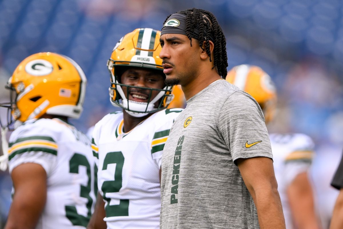 Sep 22, 2024; Nashville, Tennessee, USA;  Green Bay Packers quarterback Jordan Love (10) and Green Bay Packers quarterback Malik Willis (2) look on during pregame warmups before the game against the Tennessee Titans at Nissan Stadium. Mandatory Credit: Steve Roberts-Imagn Images