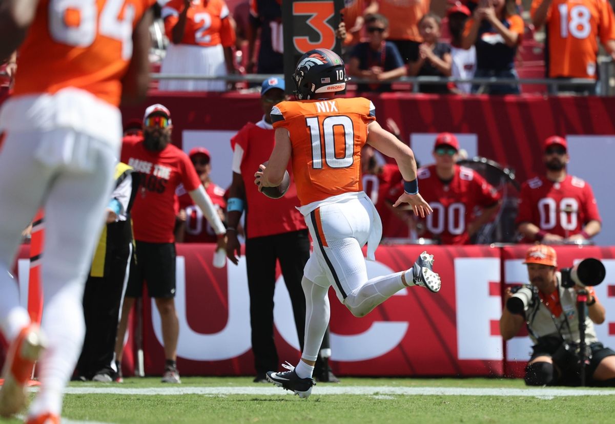 Denver Broncos quarterback Bo Nix (10) runs the ball in for a touchdown against the Tampa Bay Buccaneers during the first quarter at Raymond James Stadium. Mandatory Credit: Kim Klement Neitzel-Imagn Images