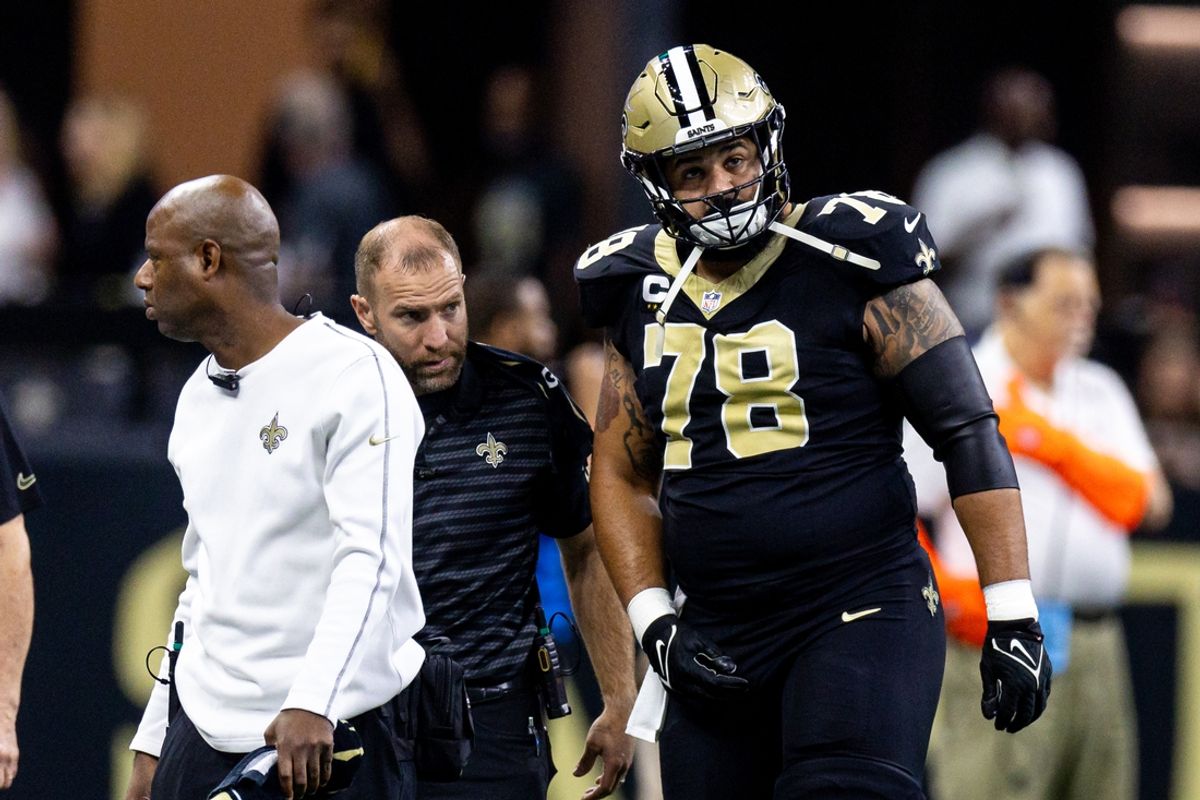 Sep 22, 2024; New Orleans, Louisiana, USA; New Orleans Saints center Erik McCoy (78) is injured on a play against the Philadelphia Eagles during the first half at Caesars Superdome. Mandatory Credit: Stephen Lew-Imagn Images