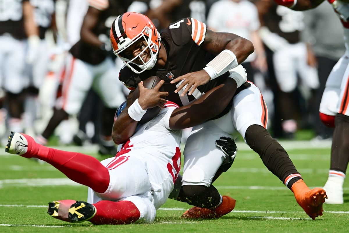 Sep 22, 2024; Cleveland, Ohio, USA; New York Giants defensive tackle Elijah Chatman (94) sacks Cleveland Browns quarterback Deshaun Watson (4) during the first quarter at Huntington Bank Field. Mandatory Credit: Ken Blaze-Imagn Images