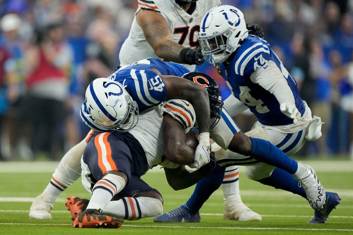 Indianapolis Colts linebacker E.J. Speed (45) tackles Chicago Bears running back D'Andre Swift (4) on Sunday, Sept. 22, 2024, during a game against the Chicago Bears at Lucas Oil Stadium in Indianapolis.