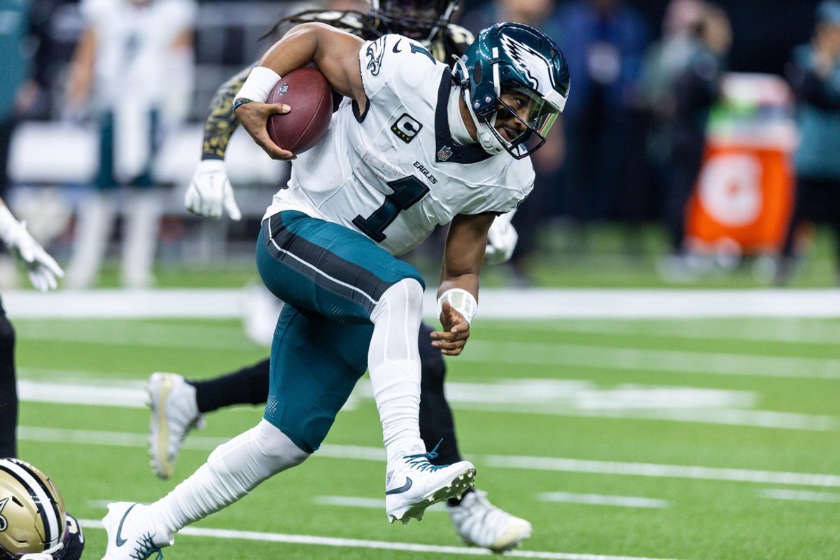 Sep 22, 2024; New Orleans, Louisiana, USA; Philadelphia Eagles quarterback Jalen Hurts (1) scrambles out the pocket against the New Orleans Saints during the first half at Caesars Superdome. Mandatory Credit: Stephen Lew-Imagn Images