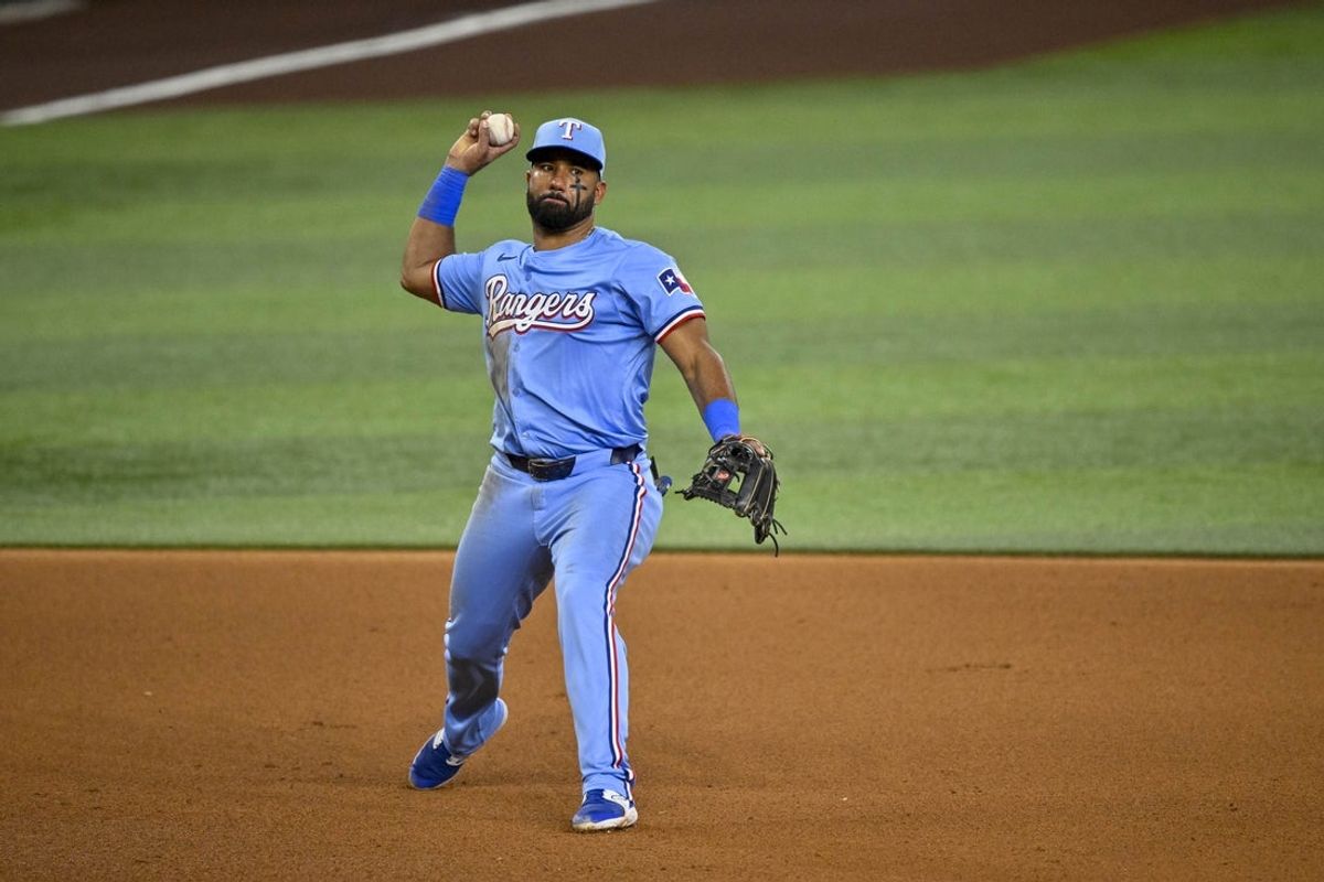 Sep 22, 2024; Arlington, Texas, USA; Texas Rangers third baseman Ezequiel Duran (20) throws to first base during the fourth inning against the Seattle Mariners at Globe Life Field. Mandatory Credit: Jerome Miron-Imagn Images