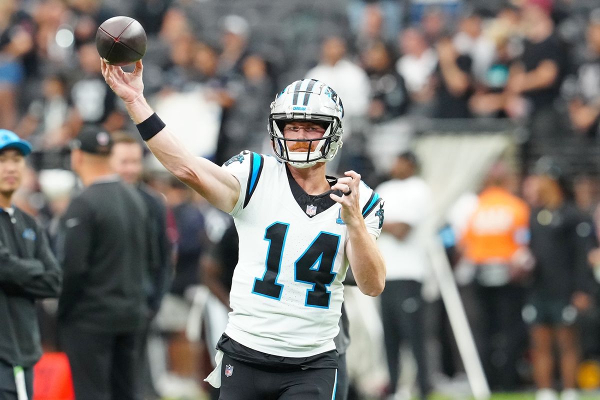 Sep 22, 2024; Paradise, Nevada, USA; Carolina Panthers quarterback Andy Dalton (14) warms up before a game against the Las Vegas Raiders at Allegiant Stadium. Mandatory Credit: Stephen R. Sylvanie-Imagn Images