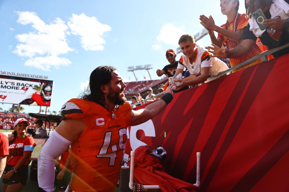 Sep 22, 2024; Tampa, Florida, USA; Denver Broncos linebacker Alex Singleton (49) greets fans after the game against the Tampa Bay Buccaneers at Raymond James Stadium. Mandatory Credit: Kim Klement Neitzel-Imagn Images