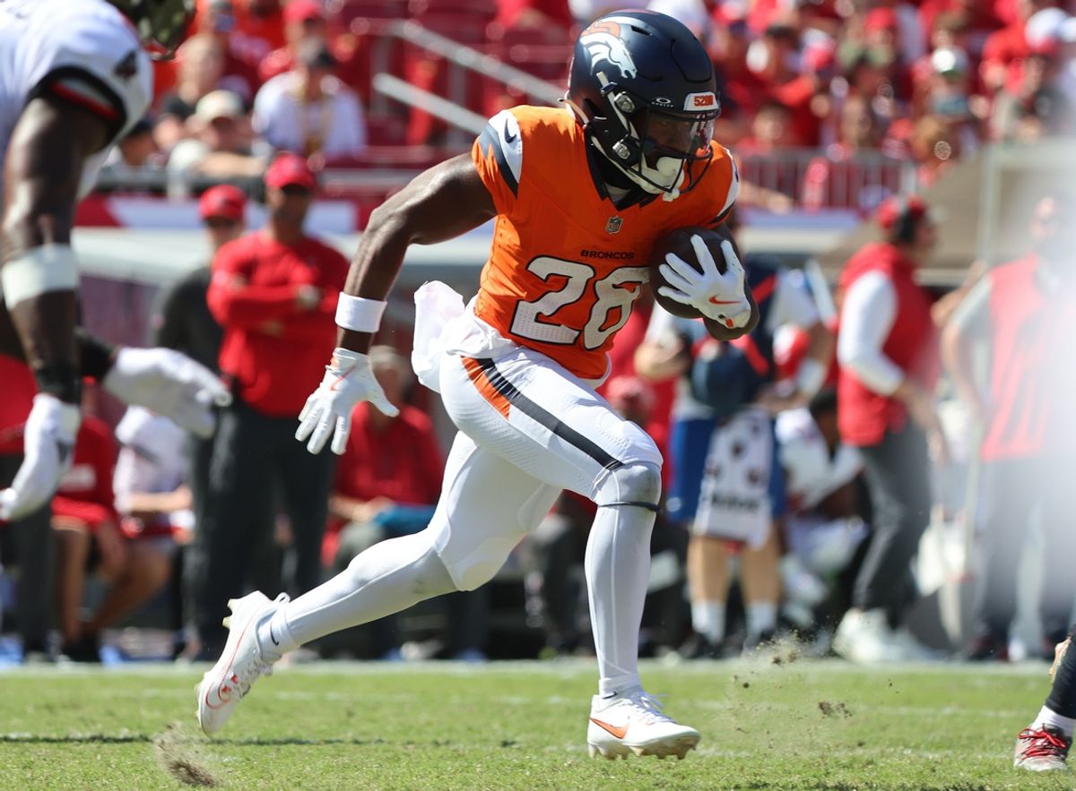 Sep 22, 2024; Tampa, Florida, USA; Denver Broncos running back Tyler Badie (28) runs with the ball against the Tampa Bay Buccaneers during the second half at Raymond James Stadium. Mandatory Credit: Kim Klement Neitzel-Imagn Images