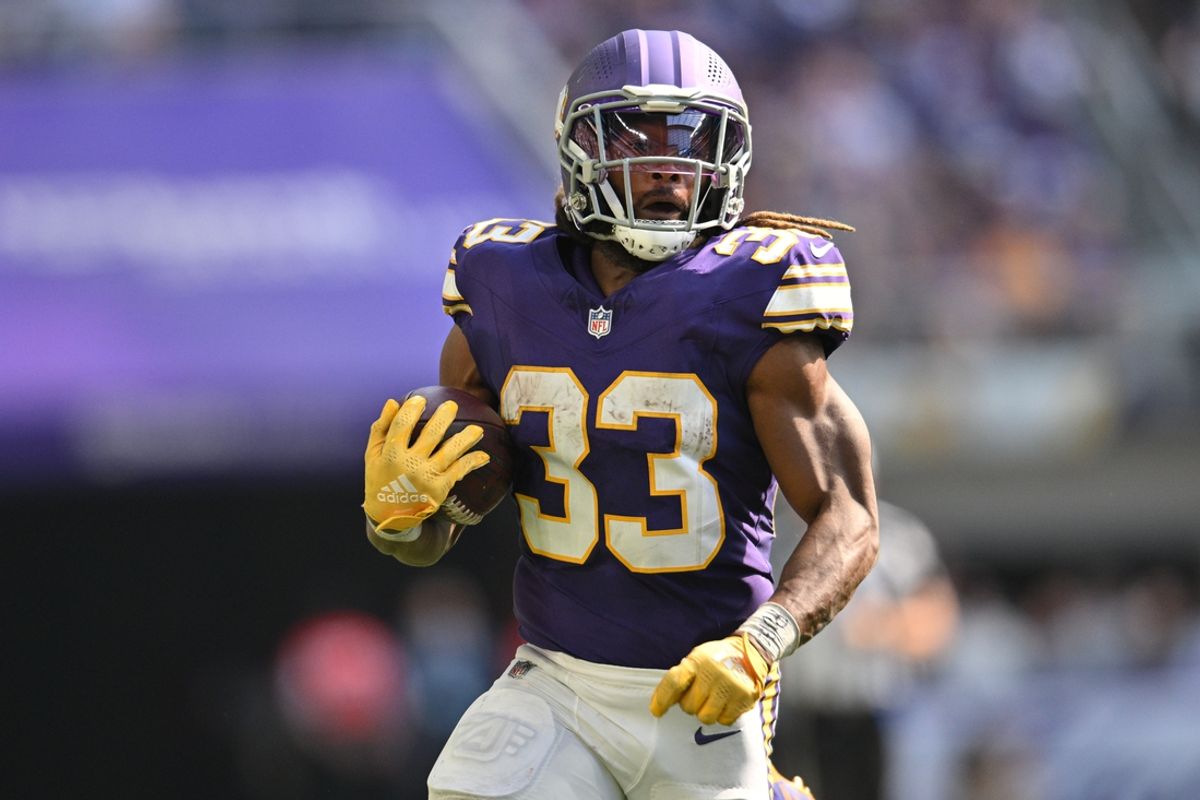 Sep 22, 2024; Minneapolis, Minnesota, USA; Minnesota Vikings running back Aaron Jones (33) runs the ball against the Houston Texans during the fourth quarter at U.S. Bank Stadium. Mandatory Credit: Jeffrey Becker-Imagn Images