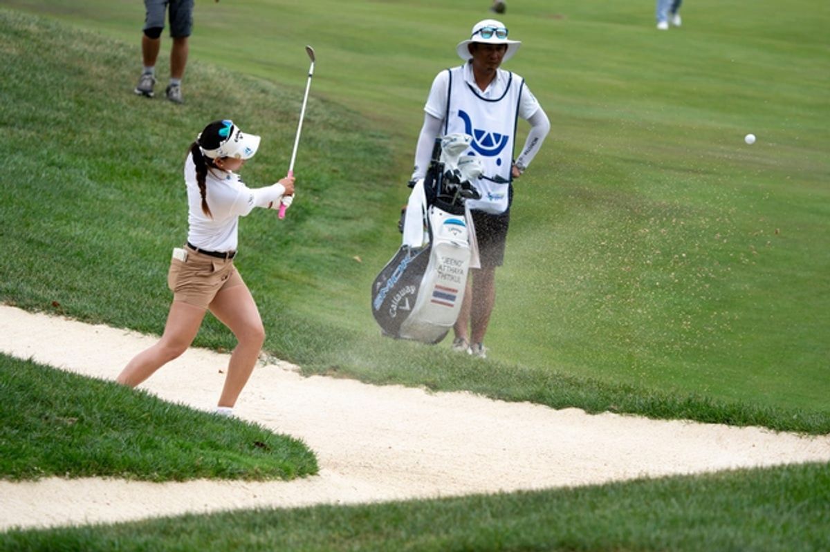 Jeeno Thitikul, of Thailand, hits out of a sand trap on the seventeenth hole during the Kroger Queen City Classic in Cincinnati on Sunday, Sept. 22, 2024.