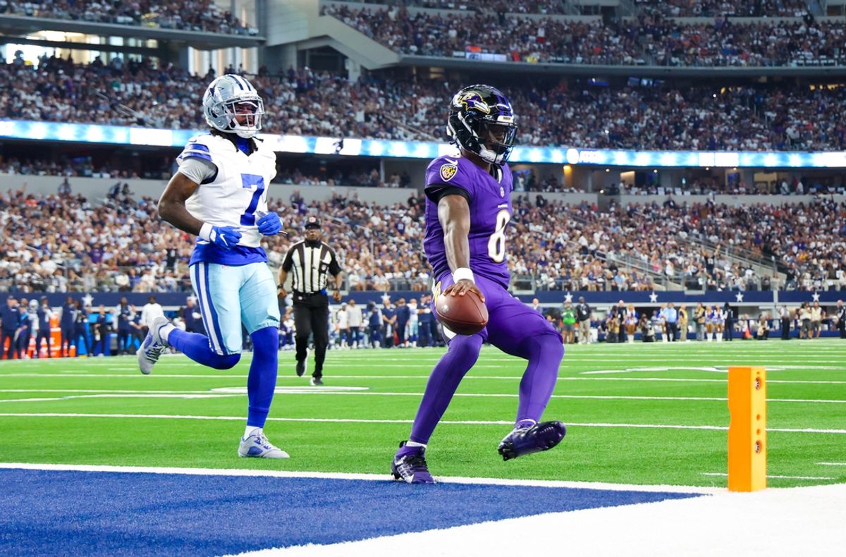 Sep 22, 2024; Arlington, Texas, USA;  Baltimore Ravens quarterback Lamar Jackson (8) runs past Dallas Cowboys cornerback Trevon Diggs (7) and scores a touchdown  during the first quarter at AT&T Stadium. Mandatory Credit: Kevin Jairaj-Imagn Images