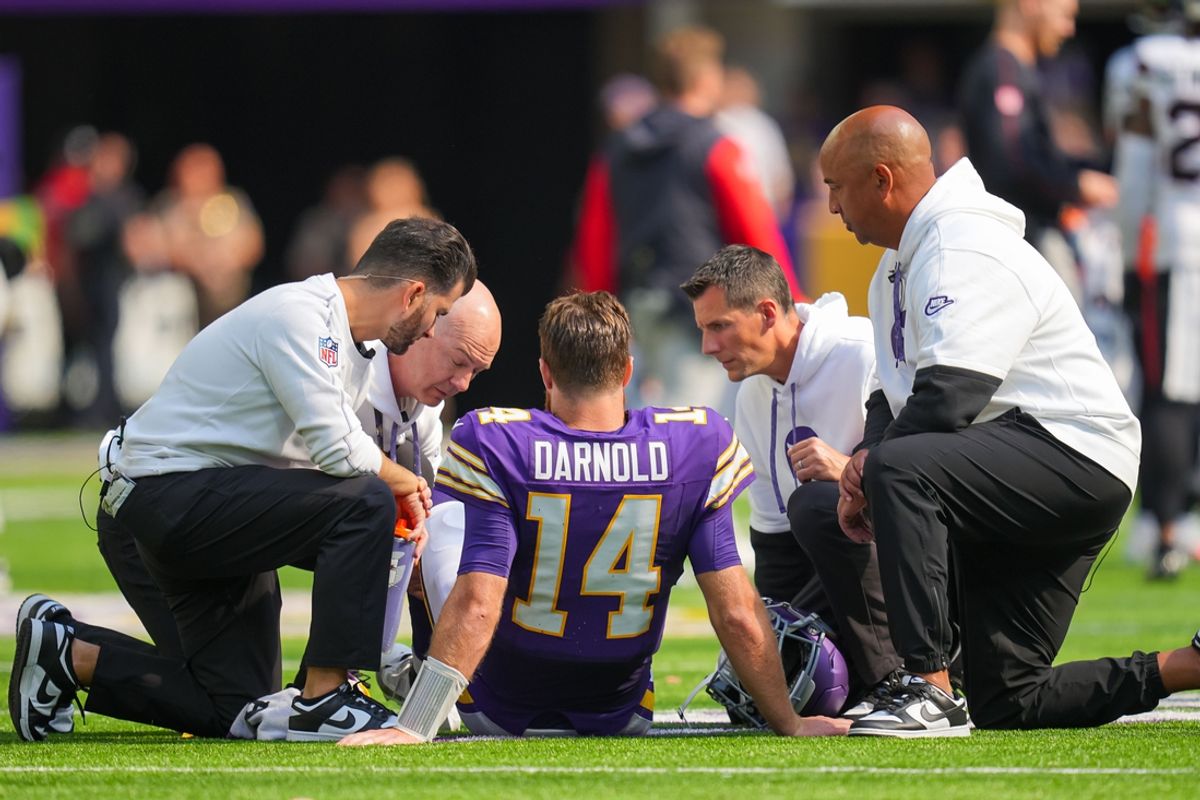 Sep 22, 2024; Minneapolis, Minnesota, USA; Minnesota Vikings quarterback Sam Darnold (14) is injured against the Houston Texans in the third quarter at U.S. Bank Stadium. Mandatory Credit: Brad Rempel-Imagn Images