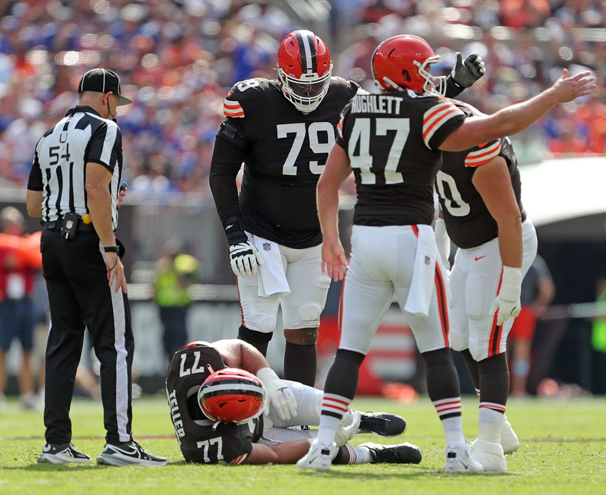 Cleveland Browns guard Wyatt Teller (77) lays on the ground after an injury during the second half of an NFL football game against the New York Giants at Huntington Bank Field, Sunday, Sept. 22, 2024, in Cleveland, Ohio.