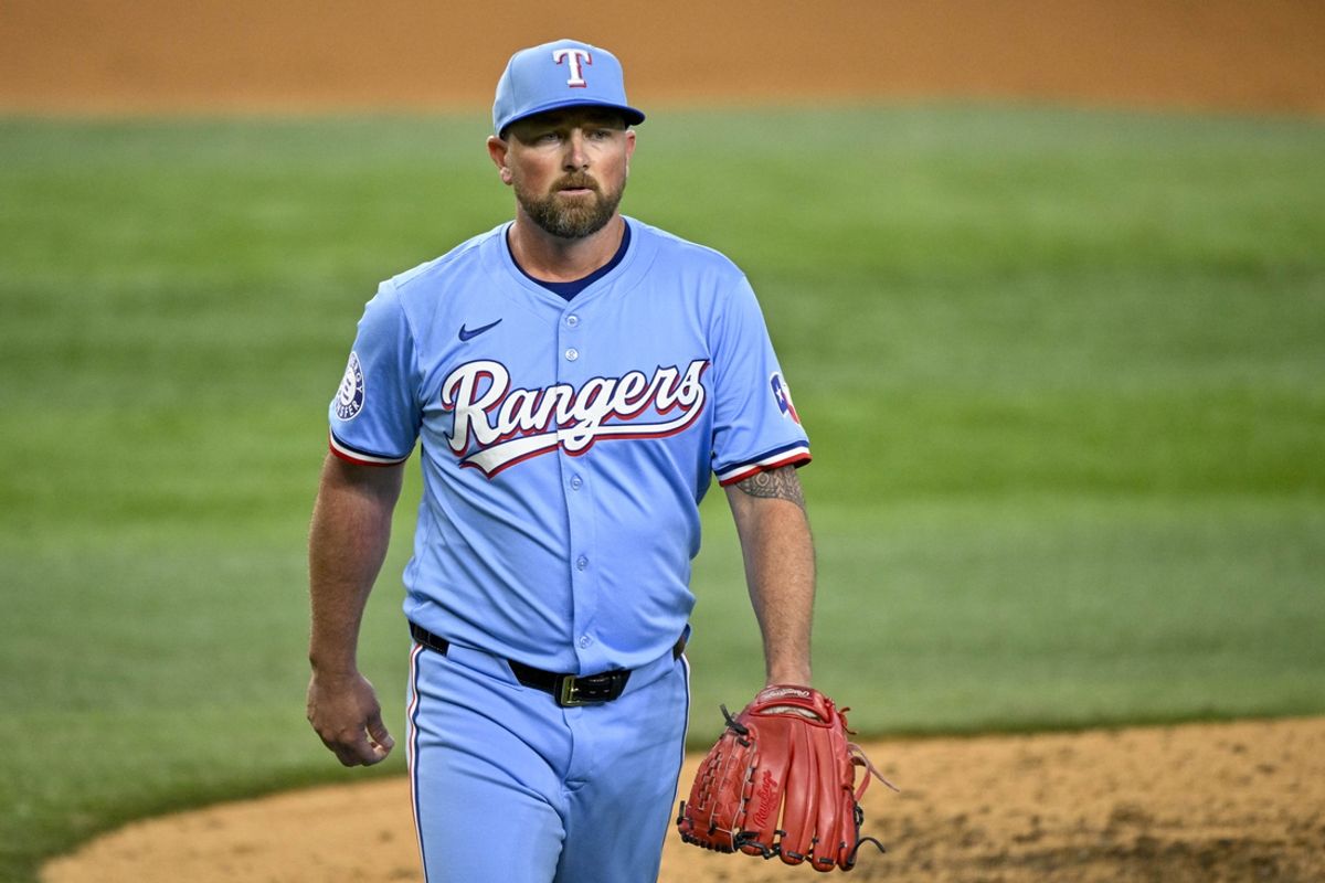 Sep 22, 2024; Arlington, Texas, USA; Texas Rangers relief pitcher Kirby Yates (39) walks off the field after he pitches against the Seattle Mariners during the ninth inning at Globe Life Field. Mandatory Credit: Jerome Miron-Imagn Images