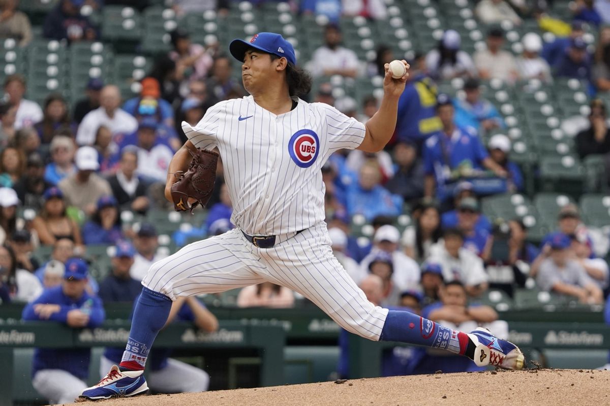 Sep 22, 2024; Chicago, Illinois, USA; Chicago Cubs pitcher Shota Imanaga (18) throws the ball against the Washington Nationals during the first inning at Wrigley Field. Mandatory Credit: David Banks-Imagn Images