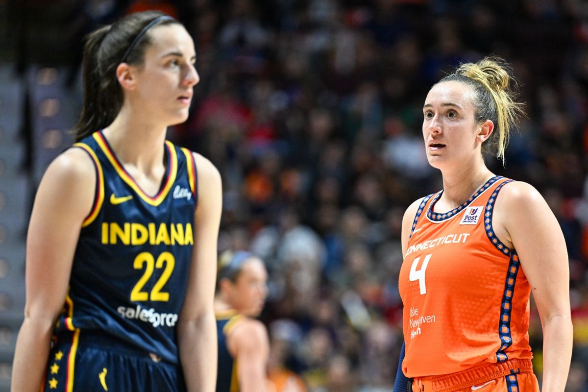 Sep 22, 2024; Uncasville, Connecticut, USA; Connecticut Sun guard Marina Mabrey (4) stares at Indiana Fever guard Caitlin Clark (22) in the third quarter during game one of the first round of the 2024 WNBA Playoffs at Mohegan Sun Arena. Mandatory Credit: Mark Smith-Imagn Images